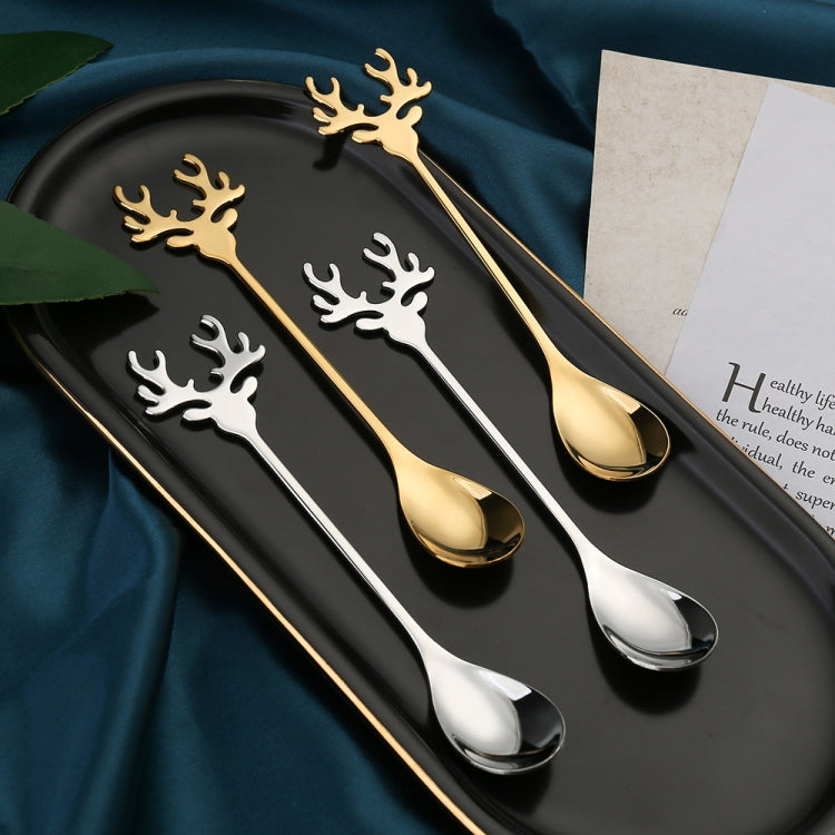 Two Christmas-themed stainless steel stirring spoons with deer design, perfect for holiday beverages.