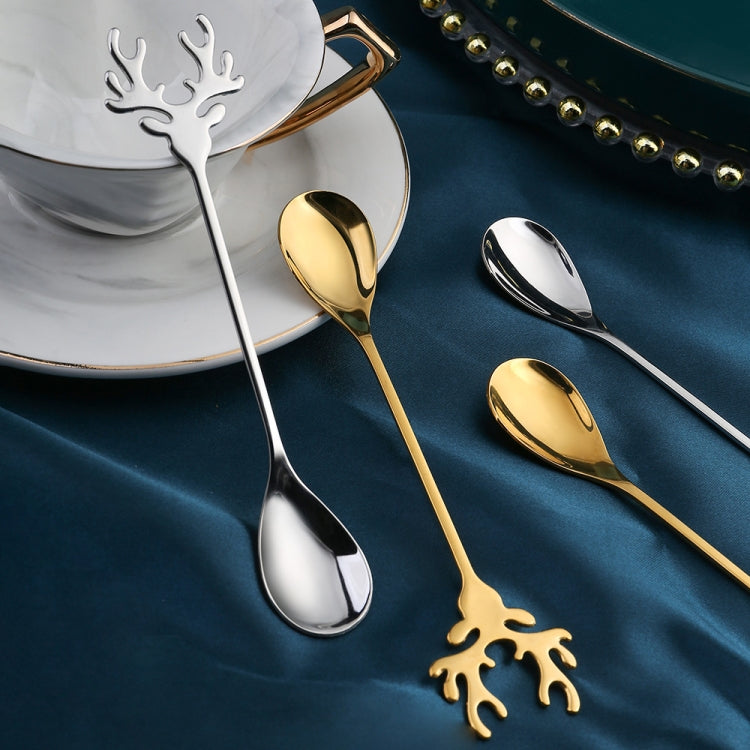 Two Christmas-themed stainless steel stirring spoons with deer design, perfect for holiday beverages.