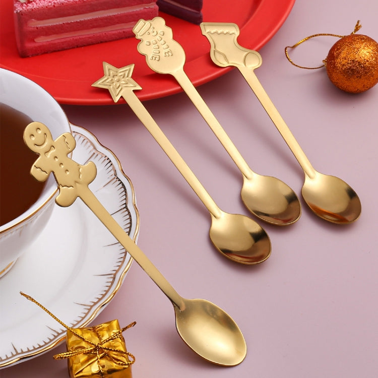 A festive 2pcs stainless steel spoon set featuring Christmas-themed designs including snowmen, stockings, and gingerbread, perfect for holiday dining.