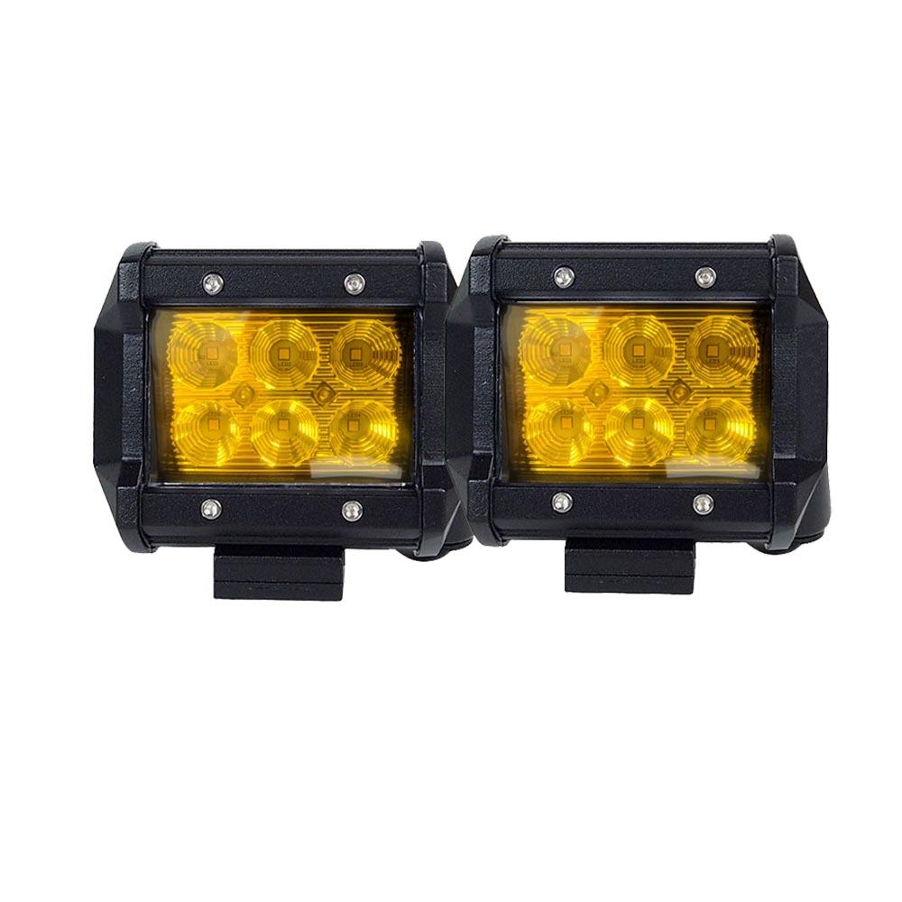 Two 4-inch flood LED light bars mounted on a truck, showcasing their bright yellow light and durable design.