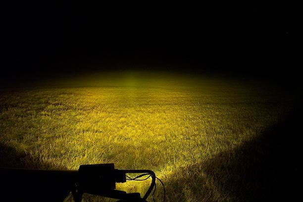 Two 4-inch flood LED light bars mounted on a truck, showcasing their bright yellow light and durable design.