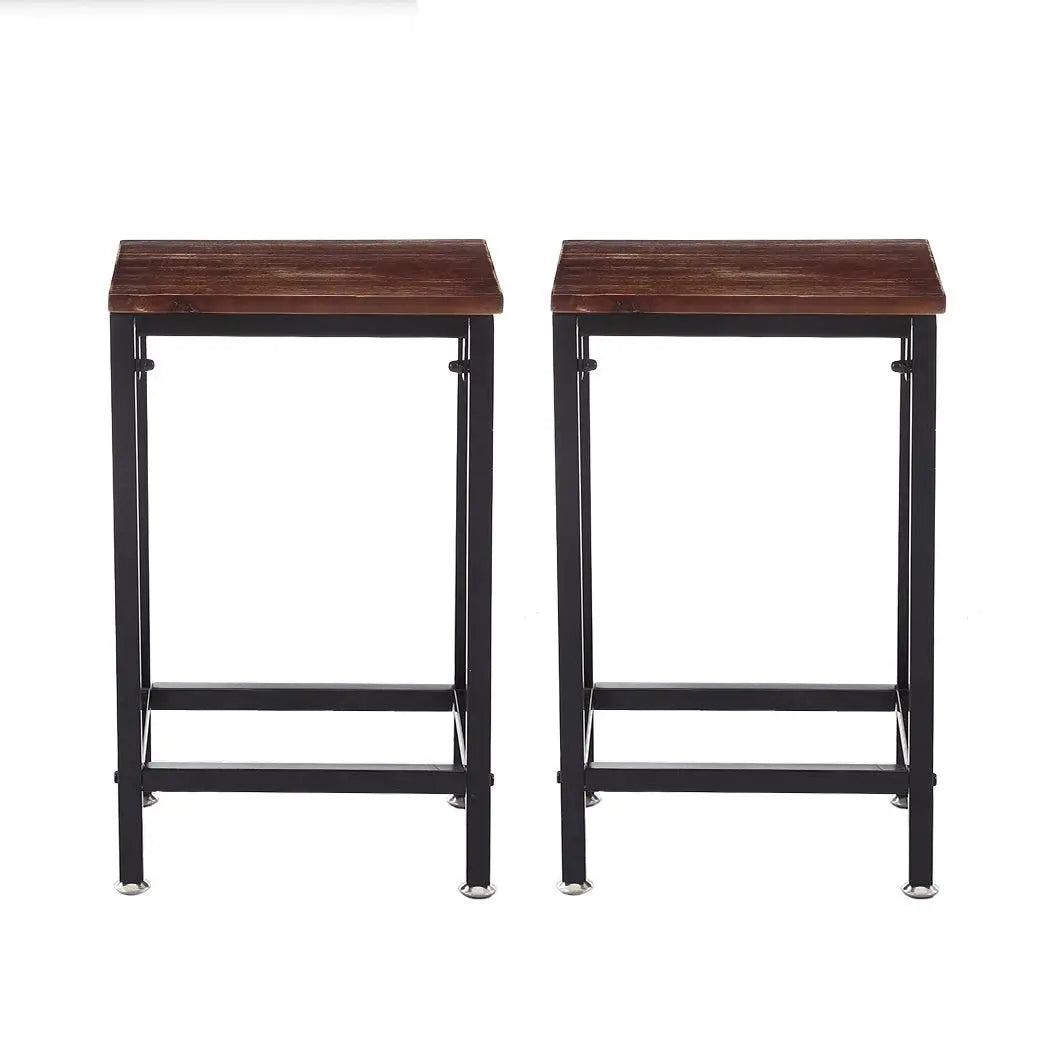 Two stylish black metal bar stools with wooden seats, perfect for kitchen or dining areas, showcasing a modern industrial design.