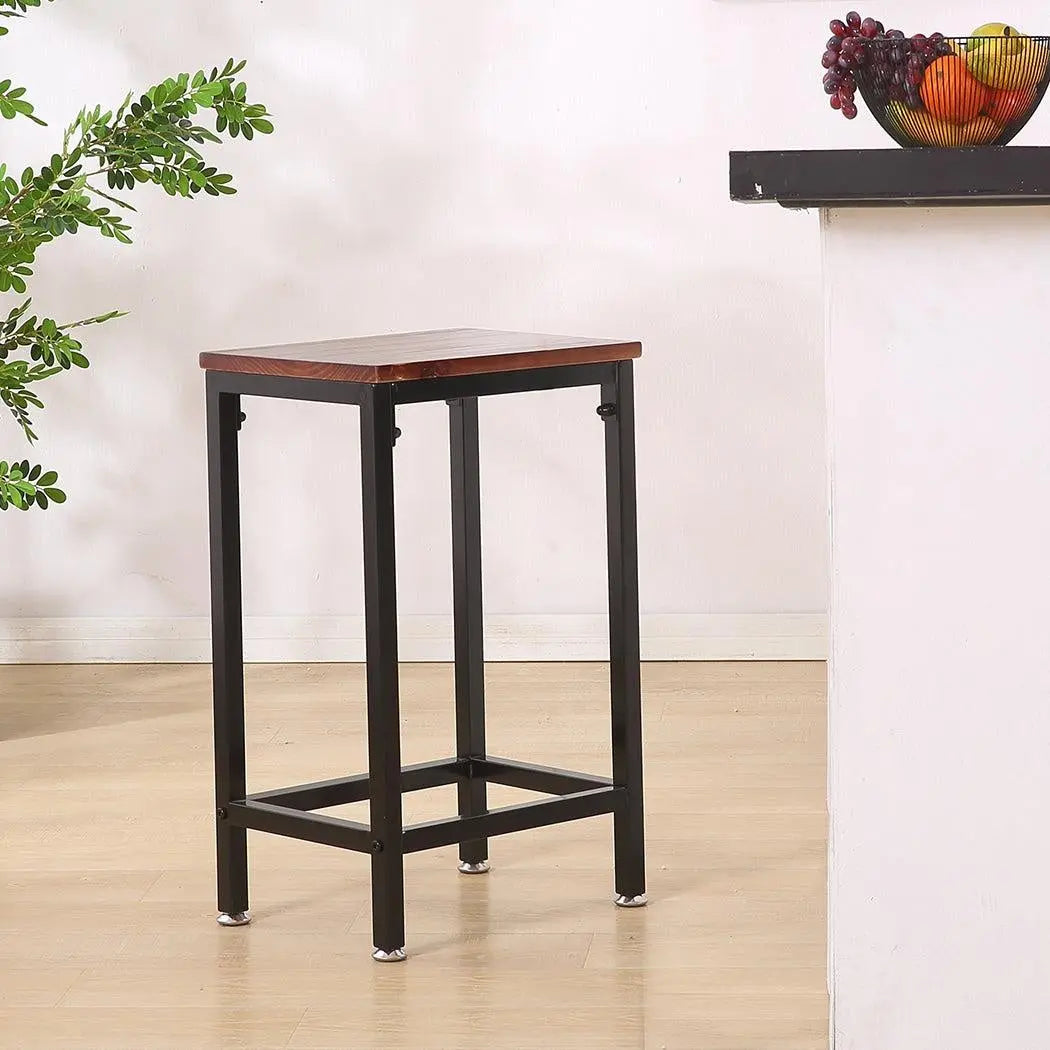 Two stylish black metal bar stools with wooden seats, perfect for kitchen or dining areas, showcasing a modern industrial design.