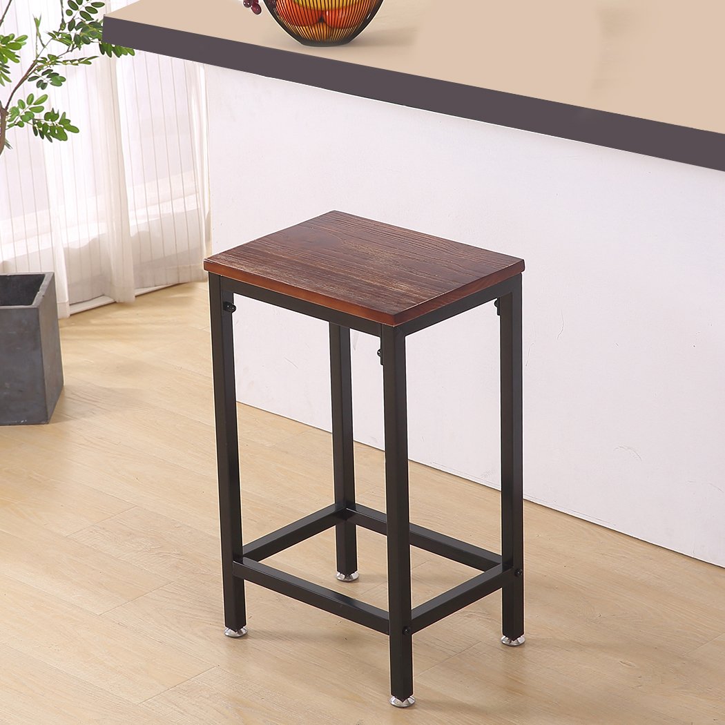 Two stylish black metal bar stools with wooden seats, perfect for kitchen or dining areas, showcasing a modern industrial design.