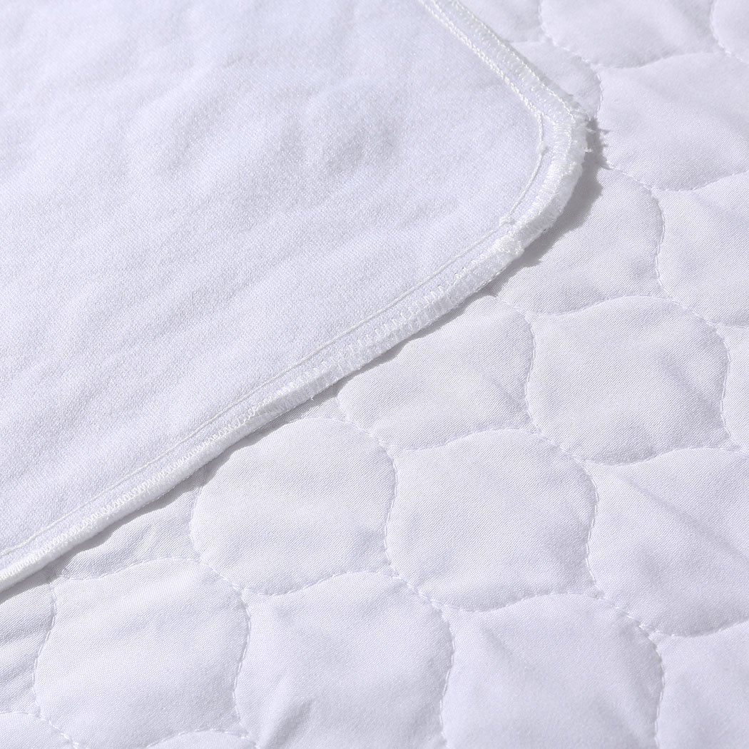 DreamZ Bed Pad, a waterproof and absorbent bed protector, featuring a smooth surface and breathable fabric, ideal for incontinence needs.