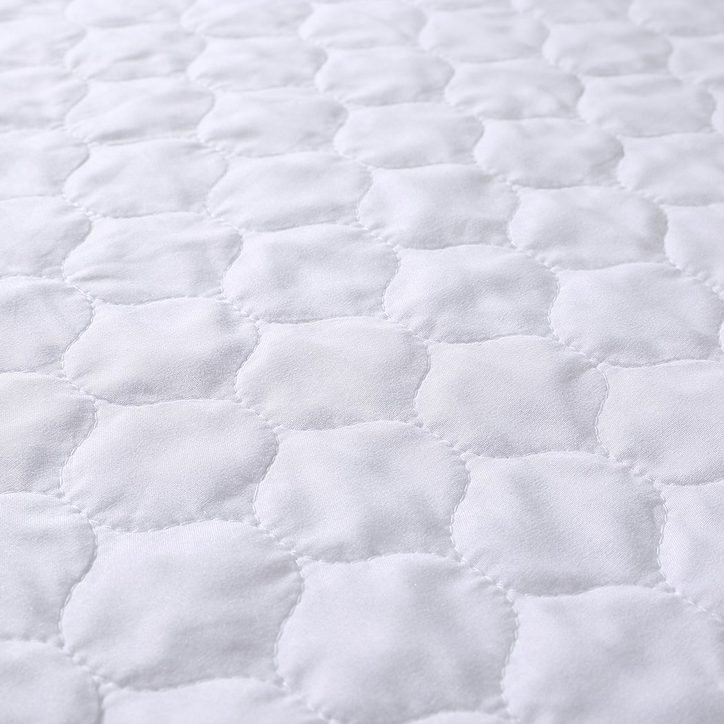 DreamZ Bed Pad, a waterproof and absorbent bed protector in white, designed for comfort and convenience.