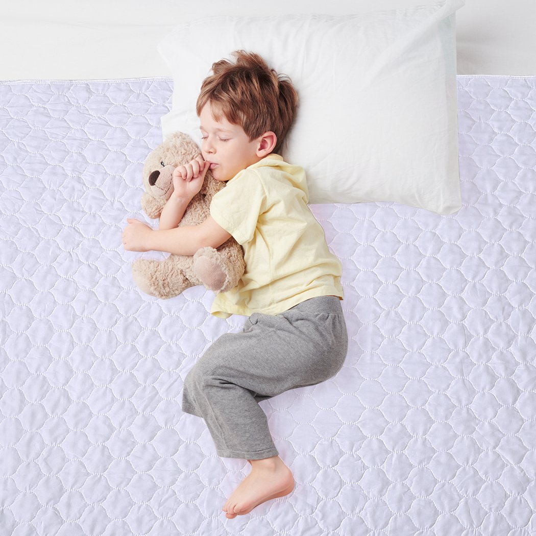 DreamZ Bed Pad, a waterproof and absorbent bed protector in white, designed for comfort and convenience.