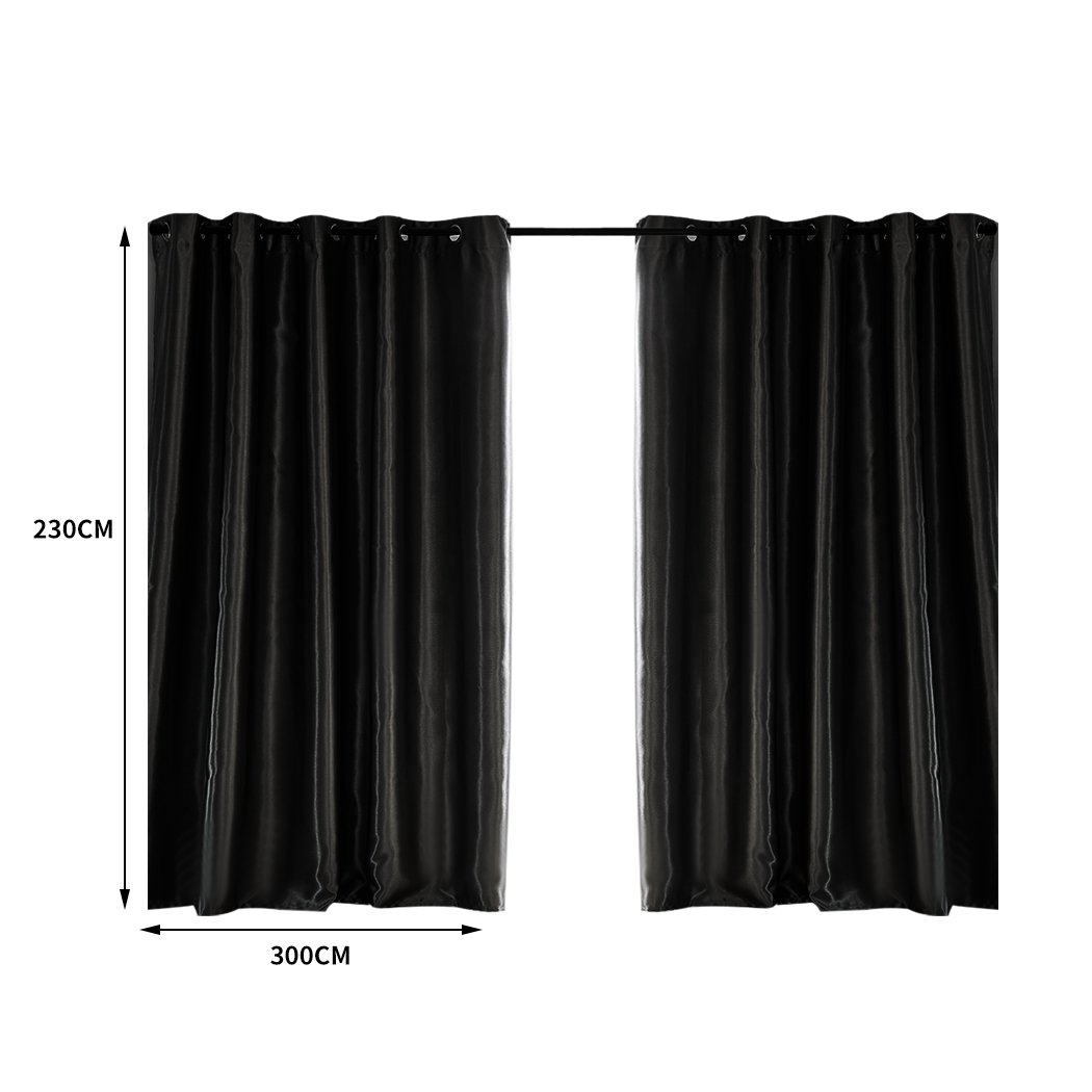 Elegant black 2X blockout curtains with eyelet design, perfect for bedrooms, providing light and noise reduction.