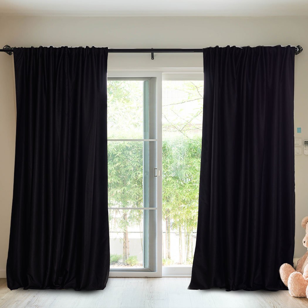 Elegant 2X Blockout Curtains in black, measuring 180cm x 230cm, designed to block sunlight and noise for a serene bedroom atmosphere.