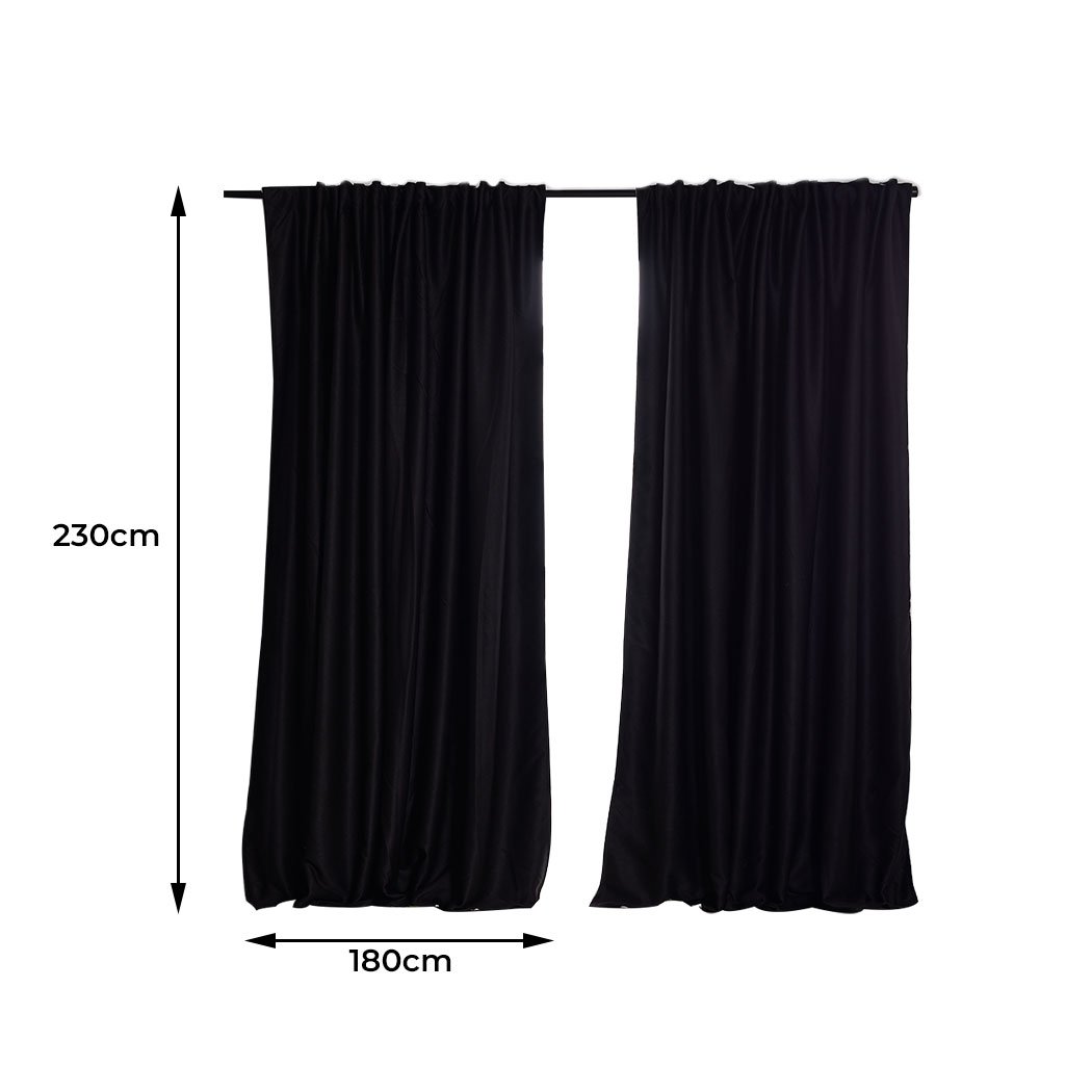 Elegant 2X Blockout Curtains in black, measuring 180cm x 230cm, designed to block sunlight and noise for a serene bedroom atmosphere.