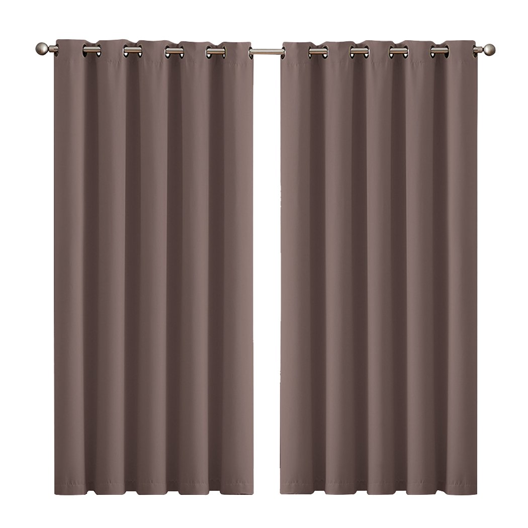 Two elegant blockout curtain panels in vibrant color, designed for room darkening and noise insulation, featuring eyelet design and triple weave fabric.