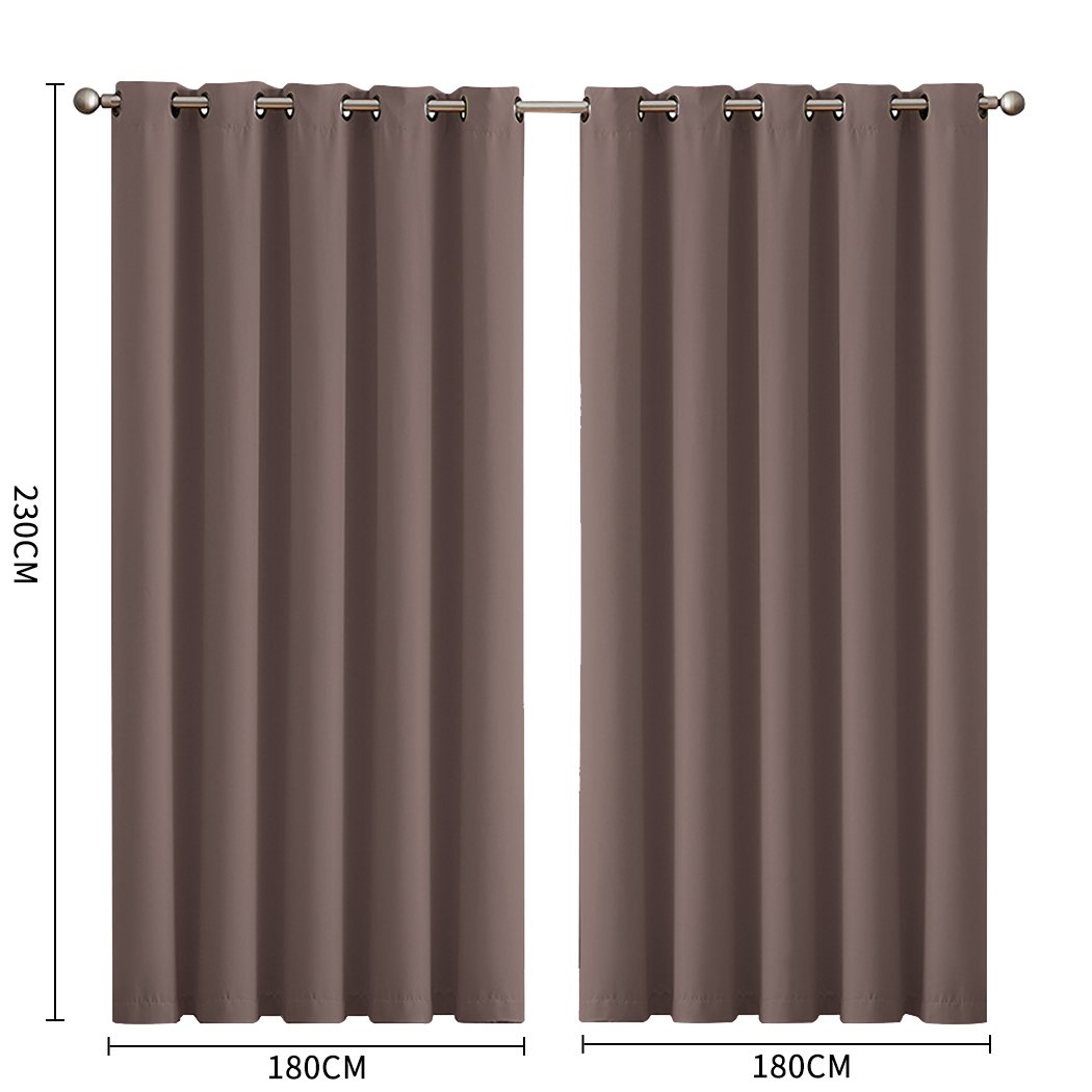 Two elegant blockout curtain panels in vibrant color, designed for room darkening and noise insulation, featuring eyelet design and triple weave fabric.