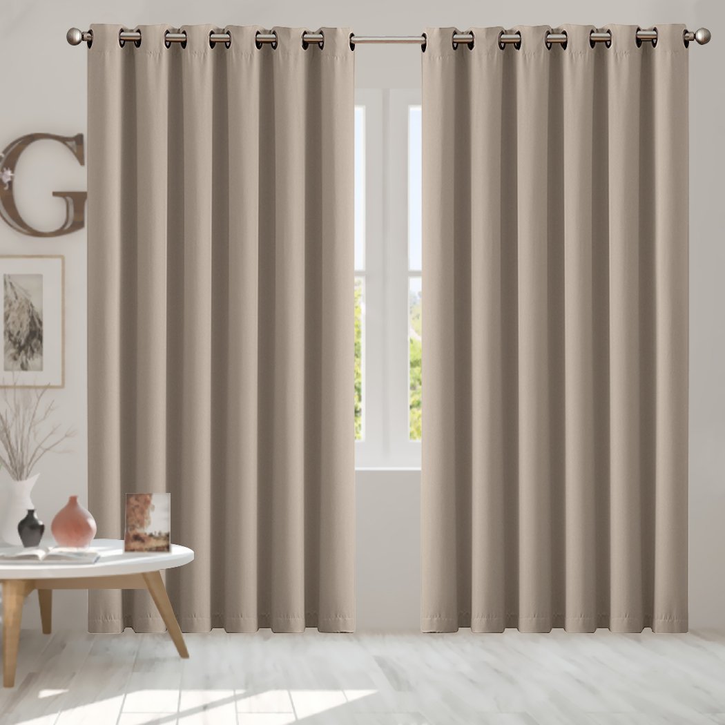 Two elegant blockout curtain panels in vibrant color, designed for room darkening and noise insulation, featuring eyelet design and triple weave fabric.