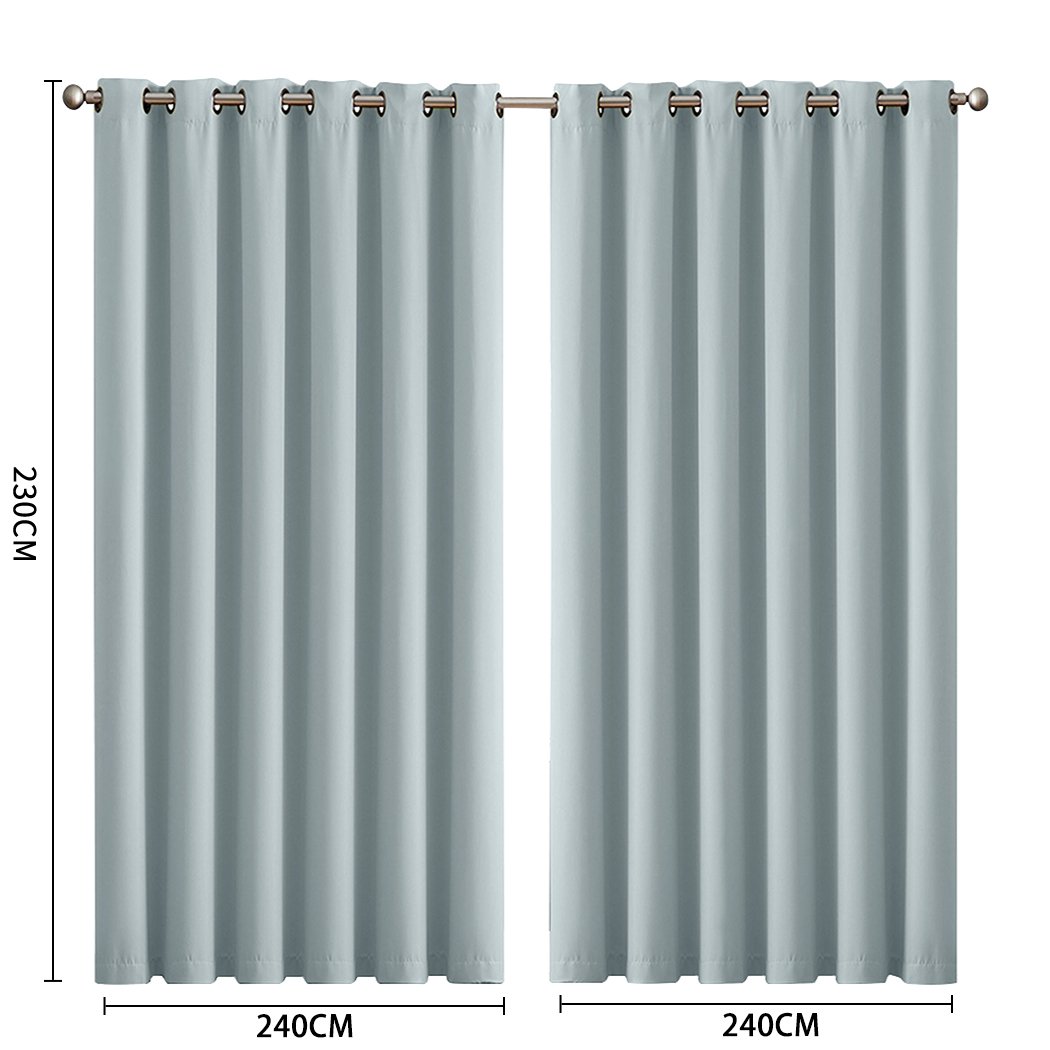 Two elegant blockout curtain panels in vibrant color, designed for room darkening and noise insulation, featuring eyelet design and triple weave fabric.