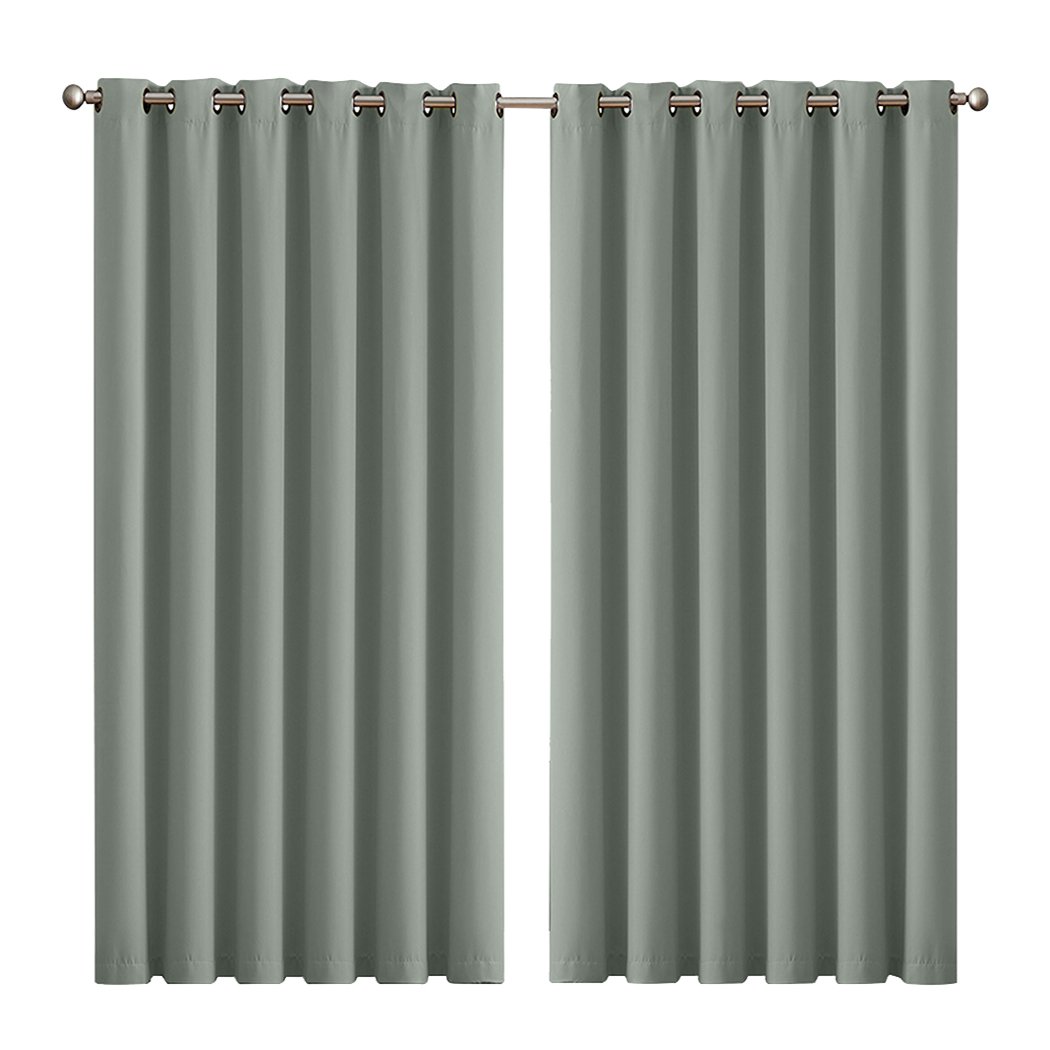 Two elegant blockout curtain panels in vibrant color, featuring eyelet design and triple weave fabric for effective room darkening.