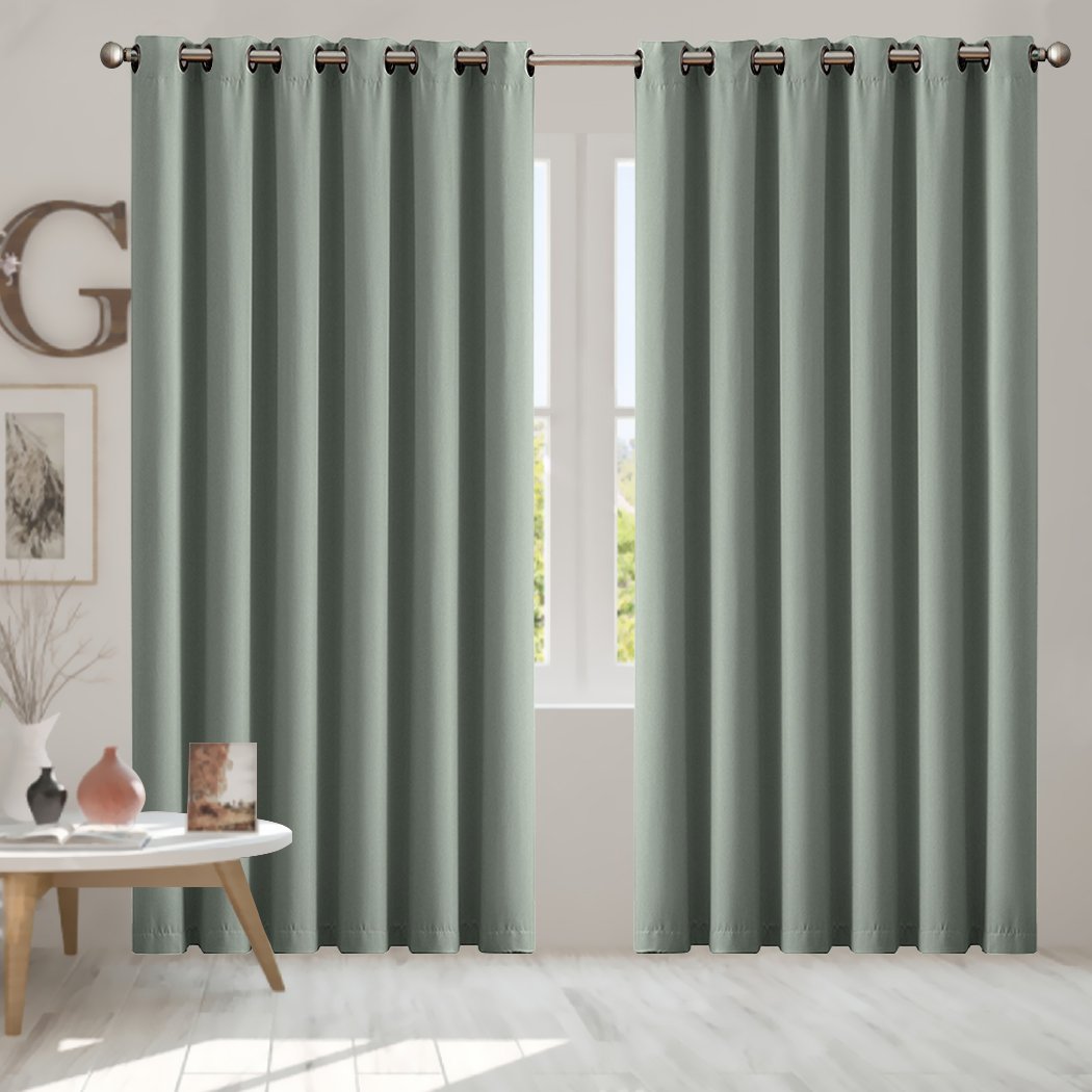 Two elegant blockout curtain panels in vibrant color, featuring eyelet design and triple weave fabric for effective room darkening.