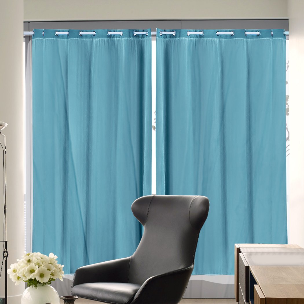 Two elegant blockout curtain panels with gauze, designed for maximum light control and stylish draping in a modern interior.