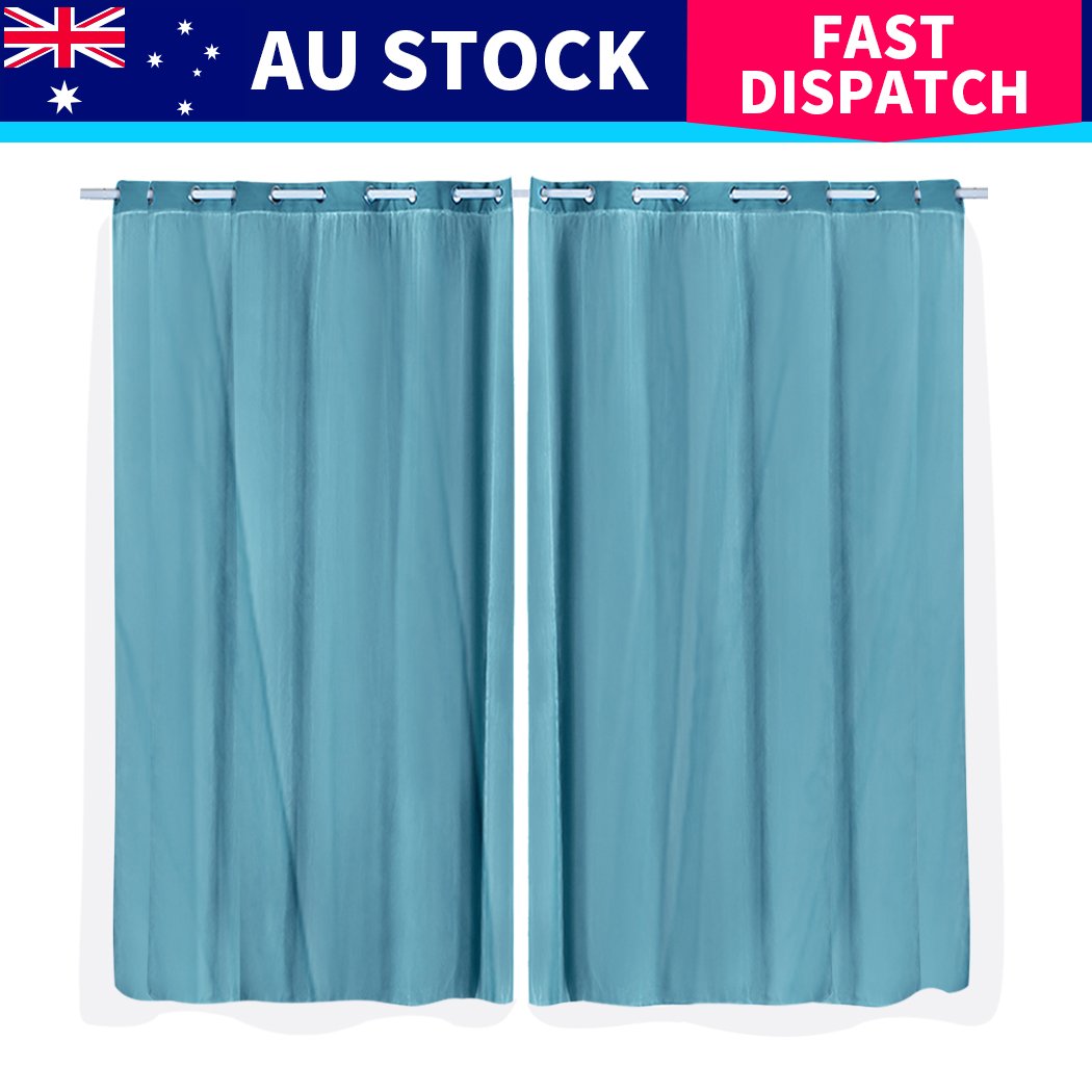 Two elegant blockout curtain panels with gauze, designed for maximum light control and stylish draping in a modern interior.