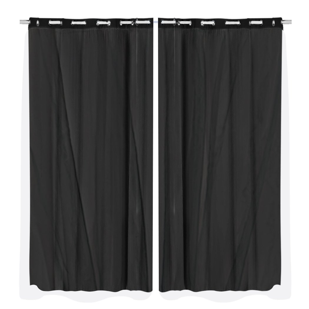 Two elegant blockout curtain panels with gauze, showcasing a rich texture and grommet top design, perfect for room darkening.