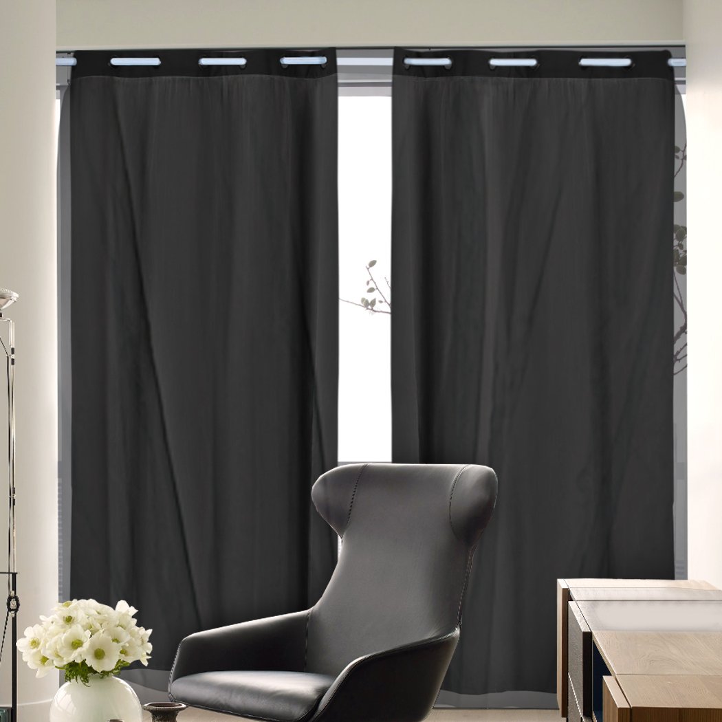 Two elegant blockout curtain panels with gauze, showcasing a 3-layer design for effective room darkening.