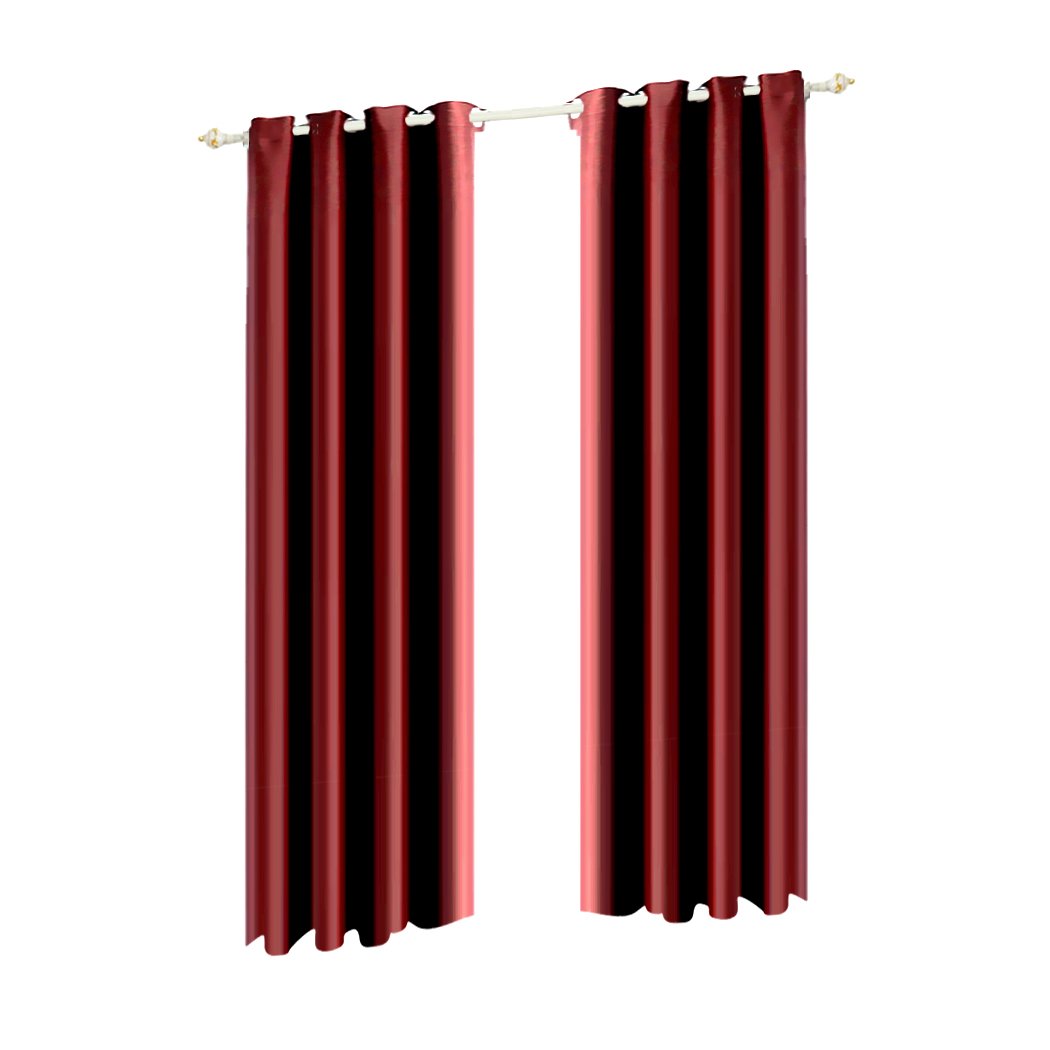 Two elegant blockout curtain panels with eyelet design, showcasing a rich color and luxurious texture, perfect for room darkening and noise insulation.