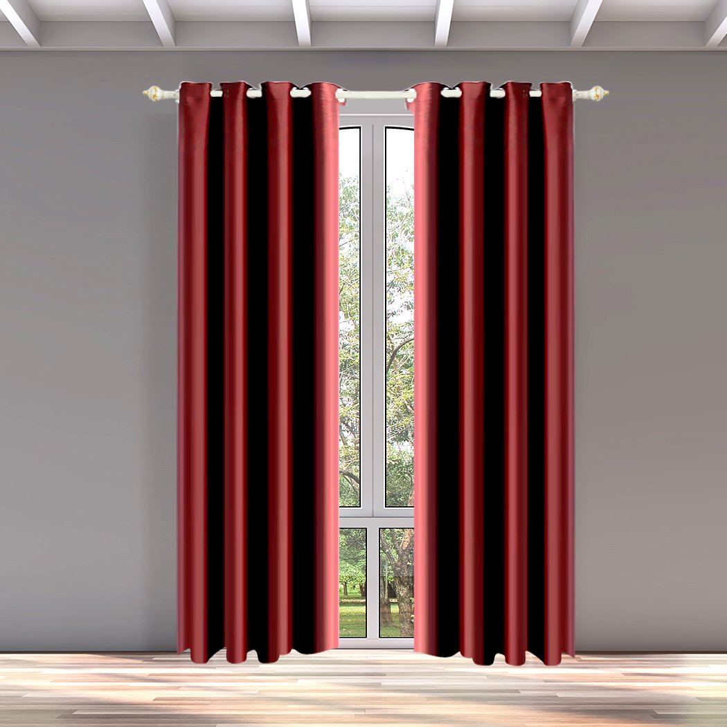 Two elegant blockout curtain panels with eyelet design, showcasing a rich color and luxurious texture, perfect for room darkening and noise insulation.