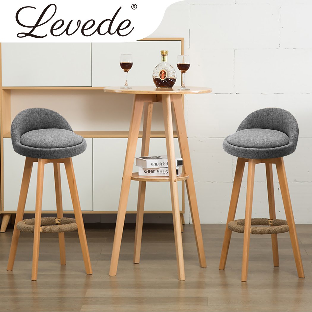 Two grey Levede fabric swivel bar stools with solid wood frames, showcasing a stylish and comfortable design for dining or socializing.