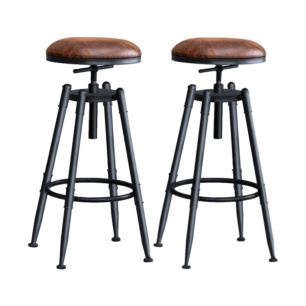 Two Levede Rustic Industrial Bar Stools with a vintage design, featuring a soft PU seat and heavy-duty steel frame, perfect for kitchens and dining areas.