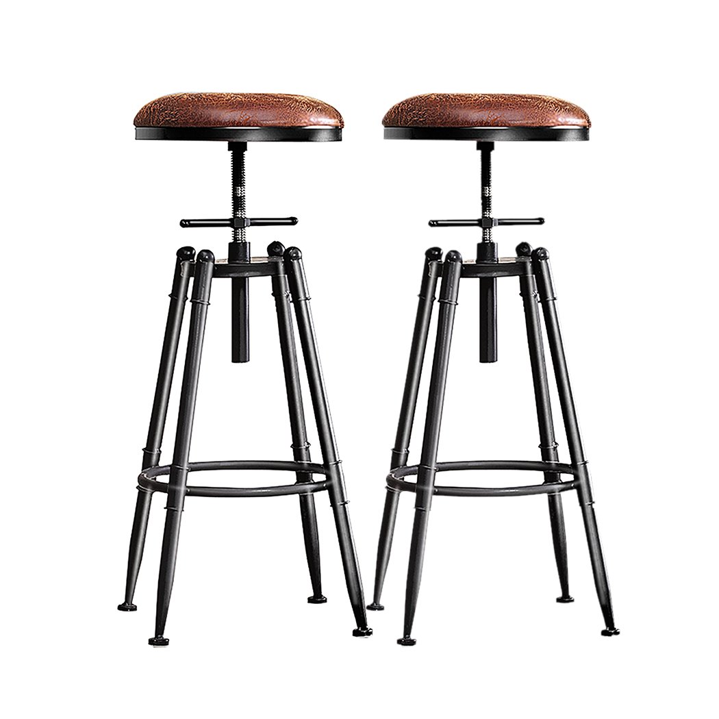 Two Levede Rustic Industrial Bar Stools with a vintage design, featuring a soft PU seat and heavy-duty steel frame, perfect for kitchens and dining areas.