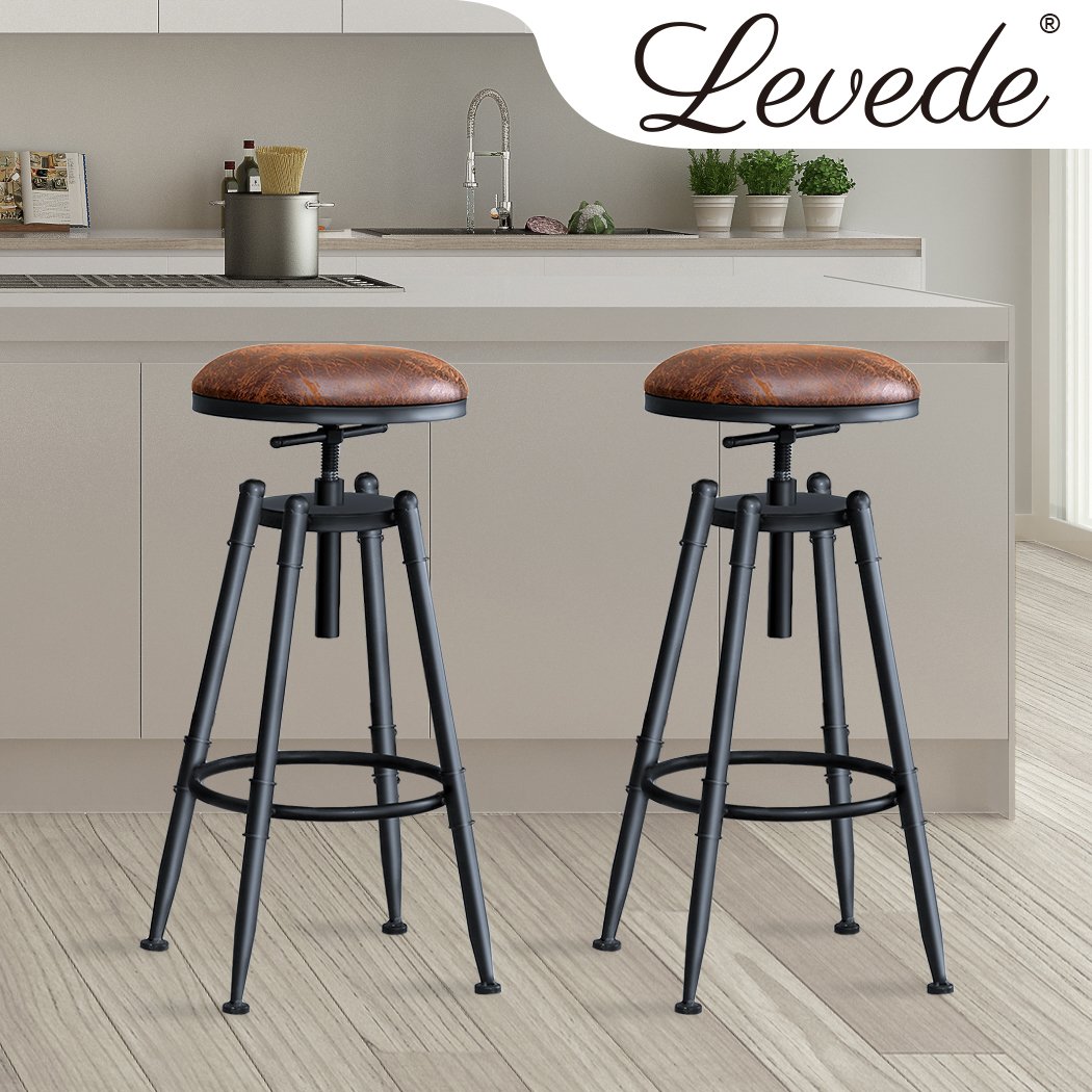 Two Levede Rustic Industrial Bar Stools with a vintage design, featuring a soft PU seat and heavy-duty steel frame, perfect for kitchens and dining areas.