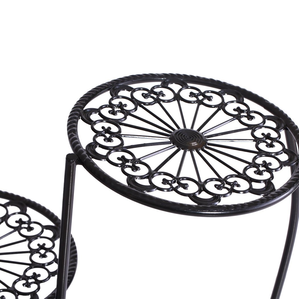 Two elegant wrought iron plant stands designed for indoor and outdoor use, featuring a delicate imitation rattan design and sturdy construction.