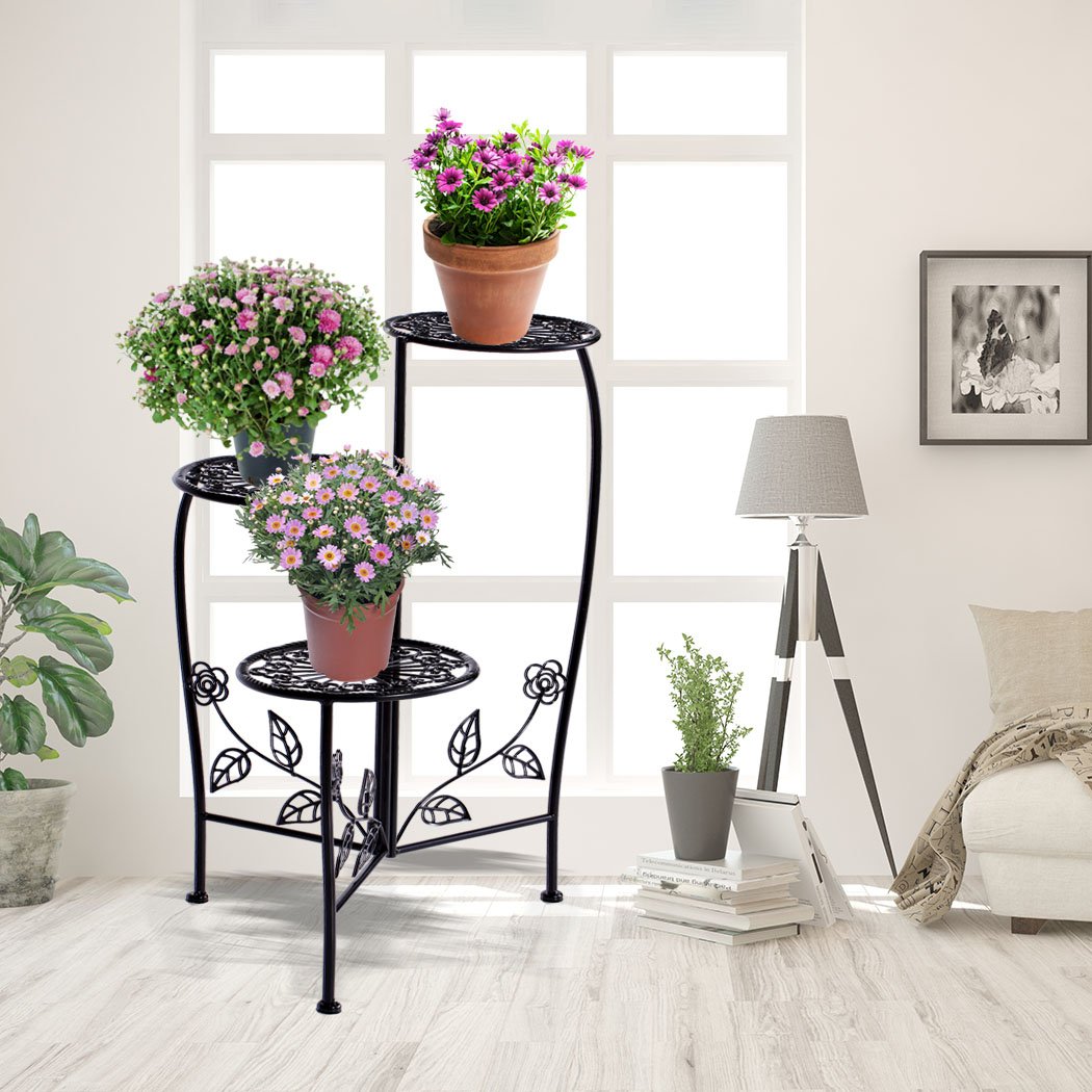 Two elegant wrought iron plant stands designed for indoor and outdoor use, featuring a delicate imitation rattan design and sturdy construction.