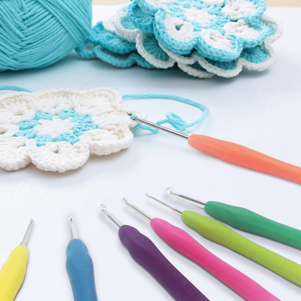 30 Pcs Crochet Hooks Kit with colorful ergonomic handles and PU leather storage bag, including various sewing tools.