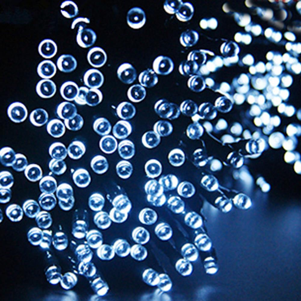 30M 300LED solar-powered fairy lights with cool white glow, perfect for garden and Christmas decoration.