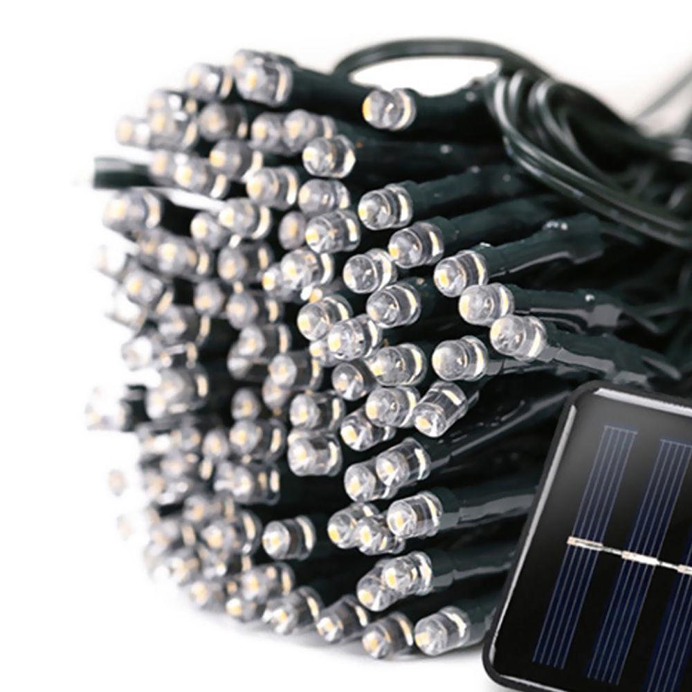 30M 300LED solar-powered fairy lights with cool white glow, perfect for garden and Christmas decoration.