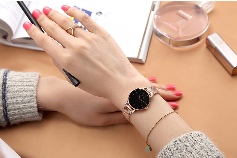 36mm Full Black Japan Quartz Movement luxury women's wristwatch with stainless steel band and round case.