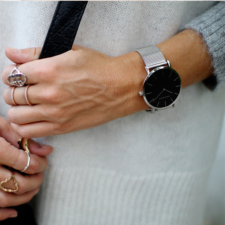 36mm Full Black Japan Quartz Movement luxury women's wristwatch with stainless steel band and round case.