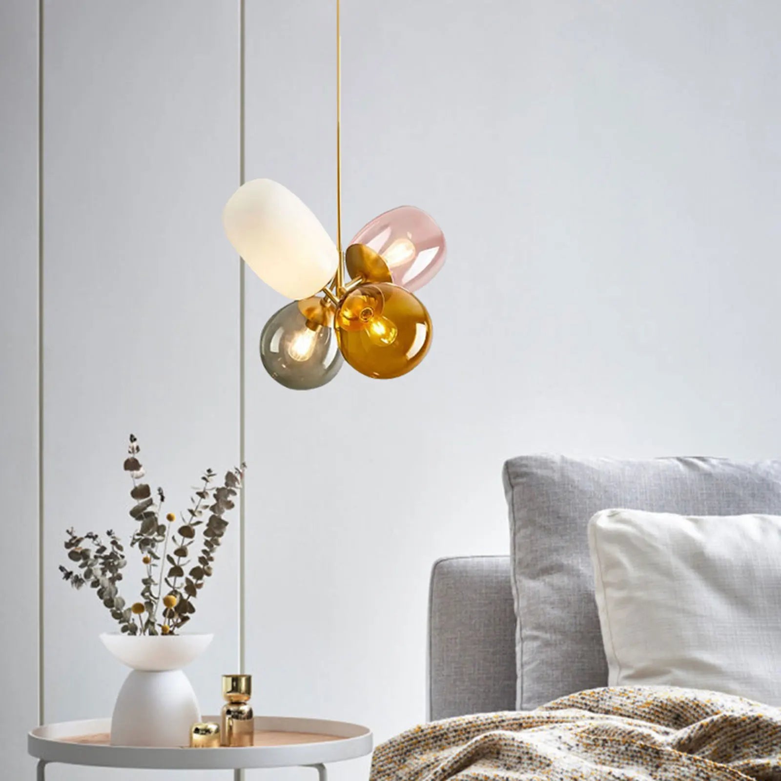 A colorful LED balloon chandelier featuring vibrant glass balls, perfect for children's rooms and stylish interiors.