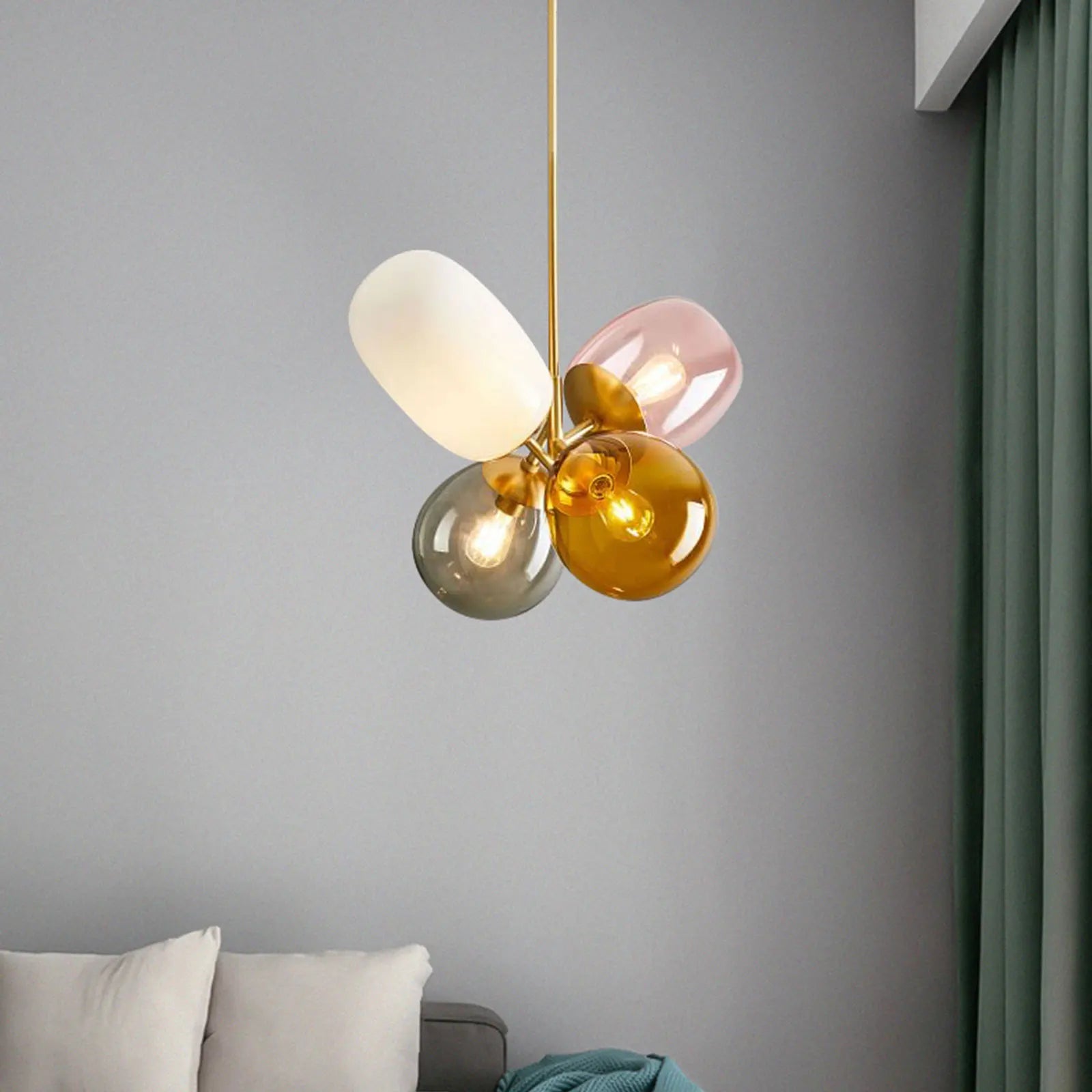 A colorful LED balloon chandelier featuring vibrant glass balls, perfect for children's rooms and stylish interiors.