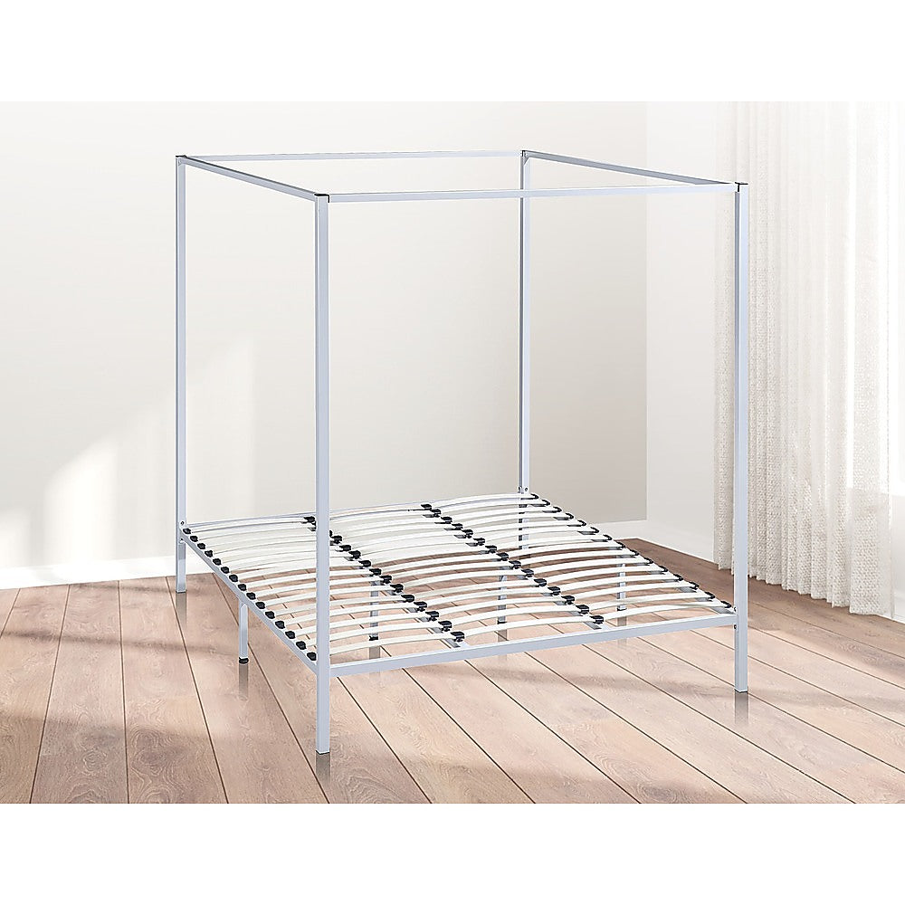 Elegant cream four poster king bed frame with sturdy steel construction, designed for comfort and style.