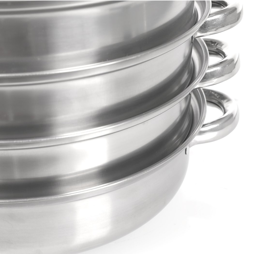 4 Tier Stainless Steel Steamer with glass lid, showcasing its multiple layers and sleek design, ideal for cooking meat and vegetables.