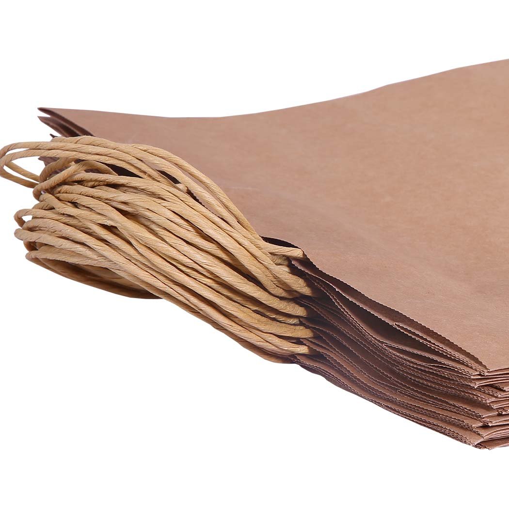 A stack of 50 eco-friendly brown paper bags with twisted hemp cord handles, showcasing their sturdy design and recyclable material.