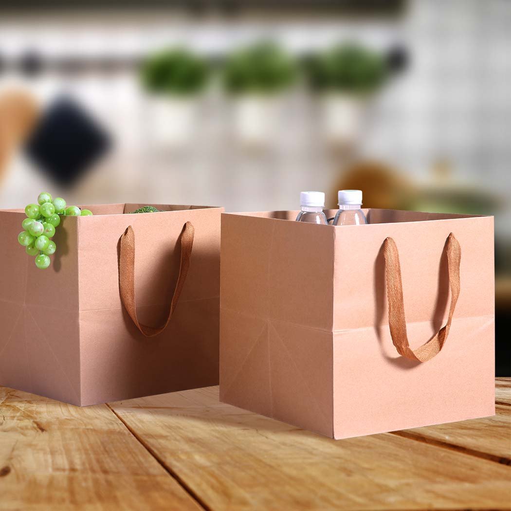 A stack of 50 brown kraft paper bags with twisted handles, showcasing their eco-friendly design and versatility for gifts and retail use.