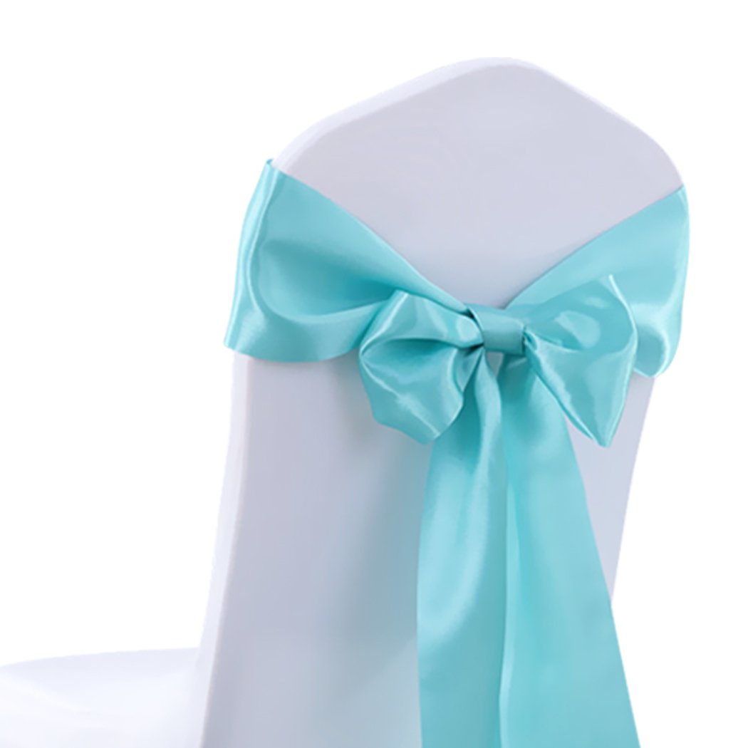 50 satin chair sashes in various colors, elegantly draped over chairs for event decoration.