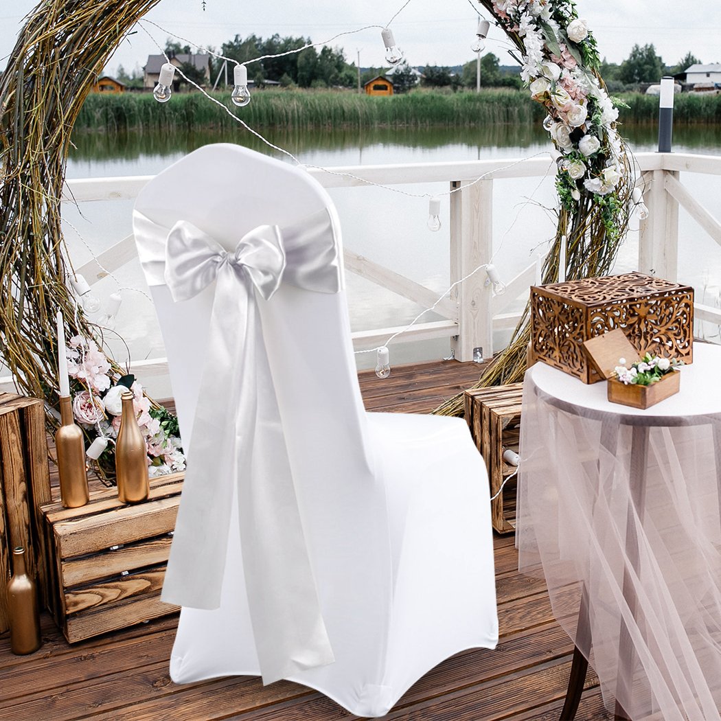 50 satin chair sashes in various colors elegantly draped over chairs, perfect for weddings and events.