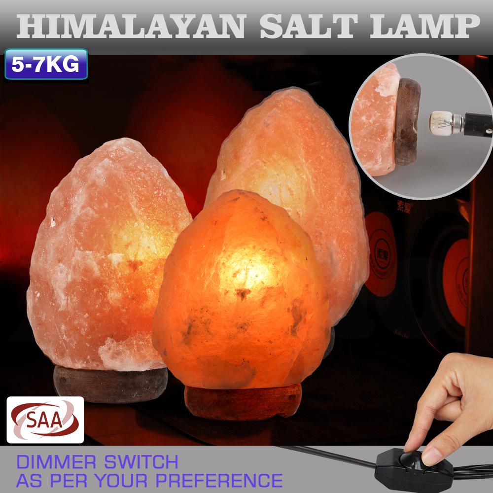 5-7 kg Himalayan salt lamp with natural light dimmer switch, showcasing its warm glow and unique crystal structure.