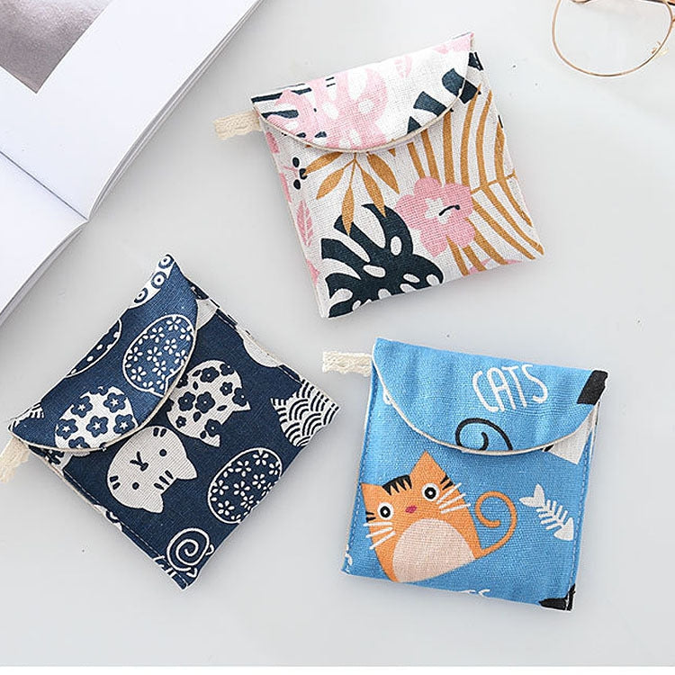 8pcs Cotton and Linen Sanitary Napkin Storage Bag featuring fun cartoon patterns and a lightweight design, perfect for storing small items.