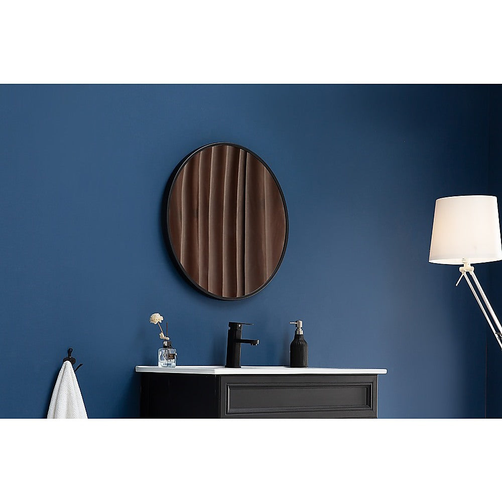 90cm Round Wall Mirror by Della Francesca with a sleek black frame, showcasing its contemporary design and clarity.