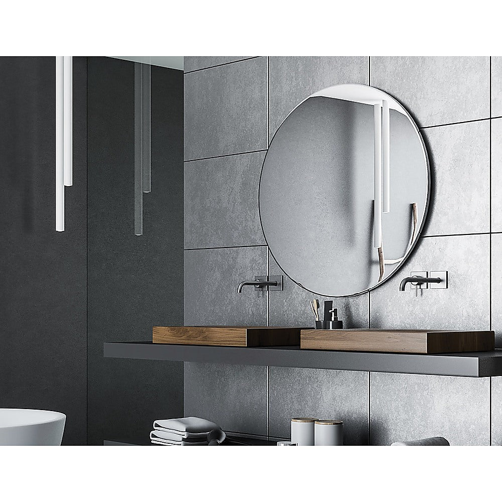 90cm Round Wall Mirror by Della Francesca with a sleek black frame, showcasing its contemporary design and clarity.