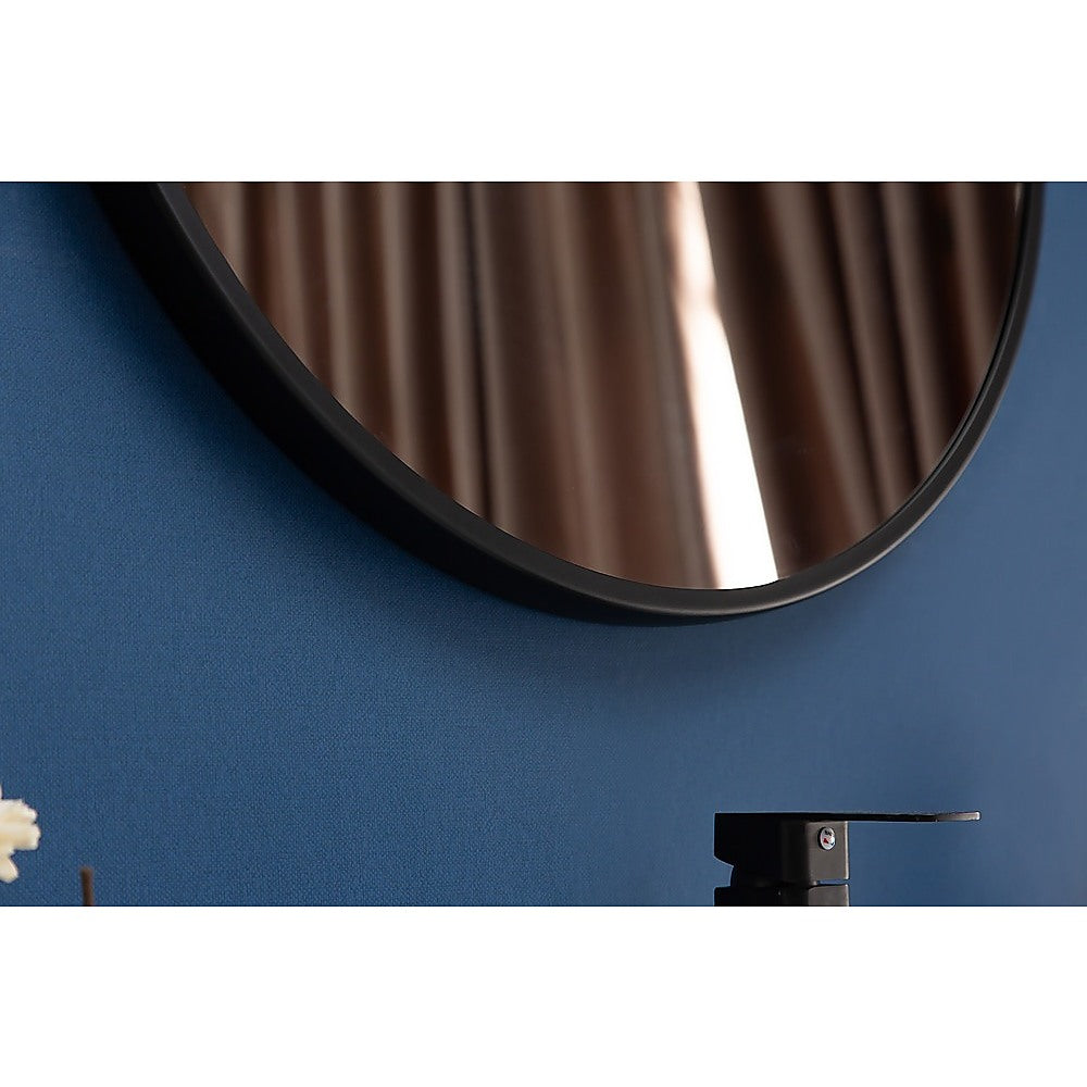 90cm Round Wall Mirror by Della Francesca with a sleek black frame, showcasing its contemporary design and clarity.